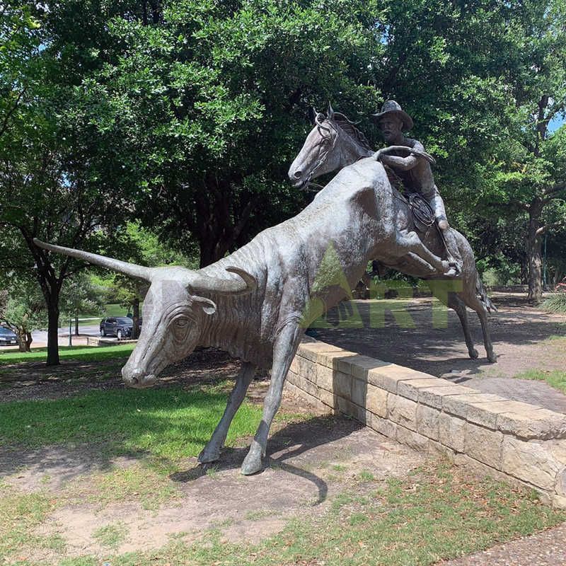 An abstract sculpture of a large exaggerated figure with a small head of bronze bull