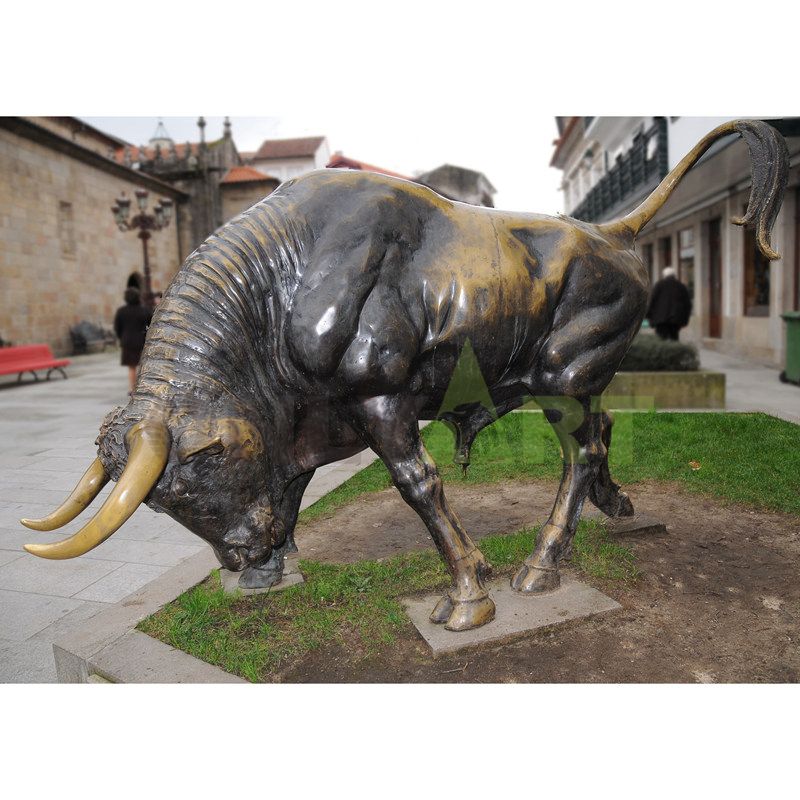 A geometric statue of a woman standing on a bull