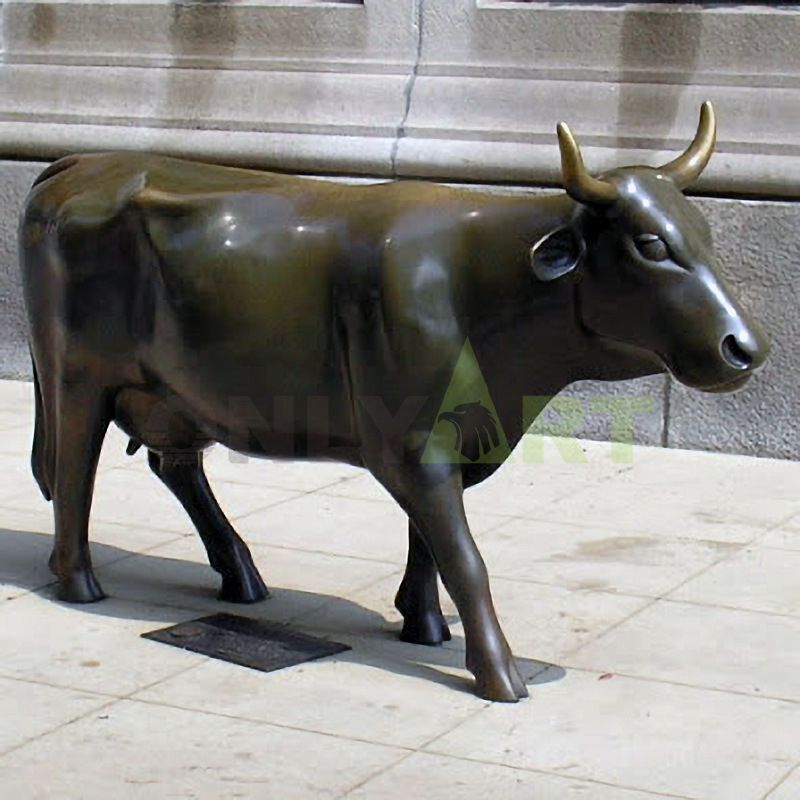 A geometric statue of a woman standing on a bull