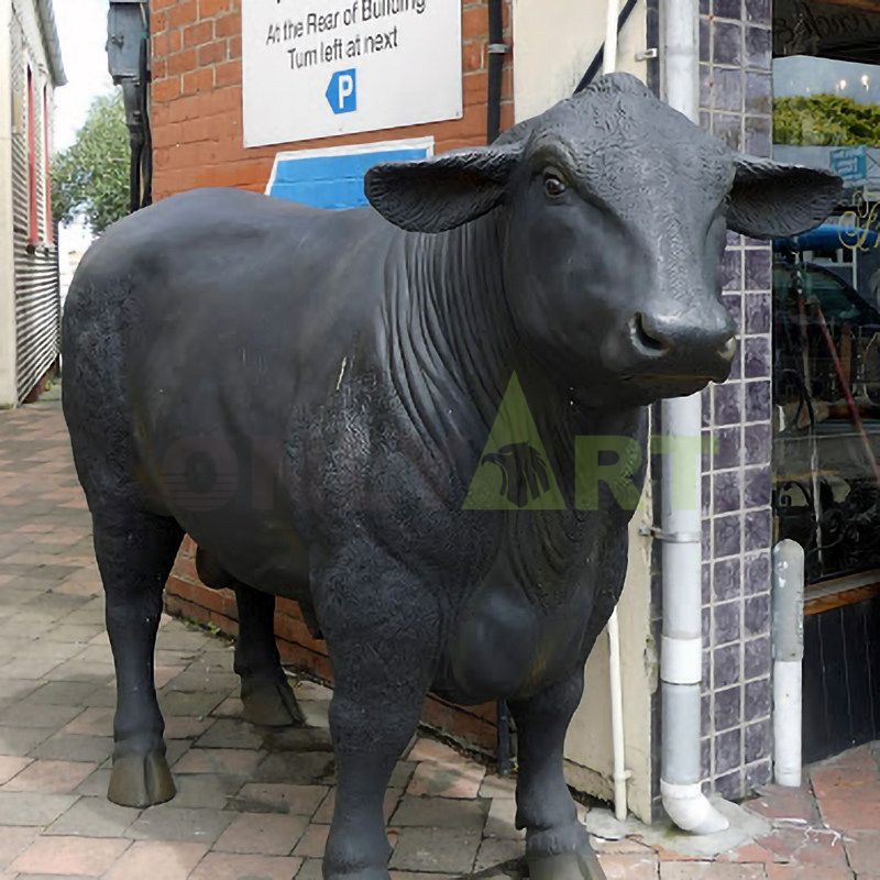 A meek cow with twine on its head