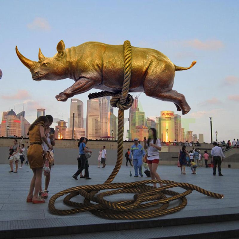 A golden rhinoceros tied to a magic rope