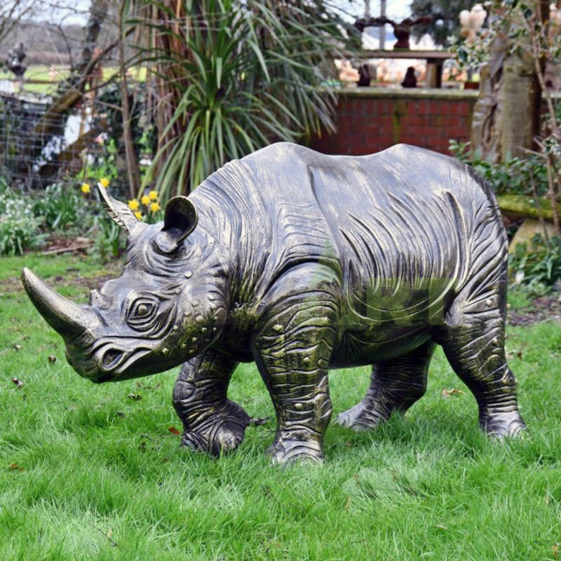 Rhinoceros bronze sculpture breaks through the fence