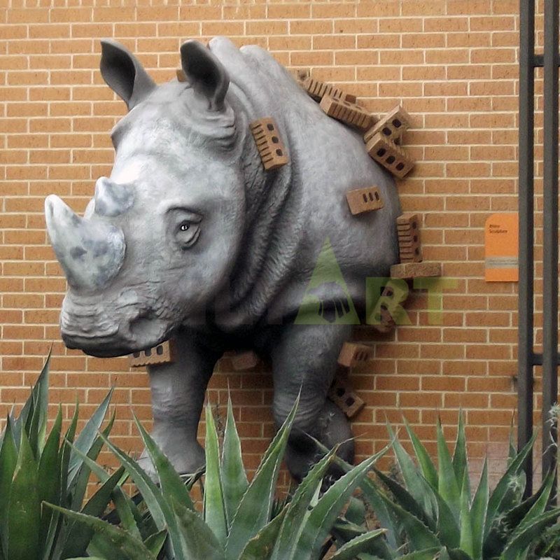 A large bronze statue of an African rhino