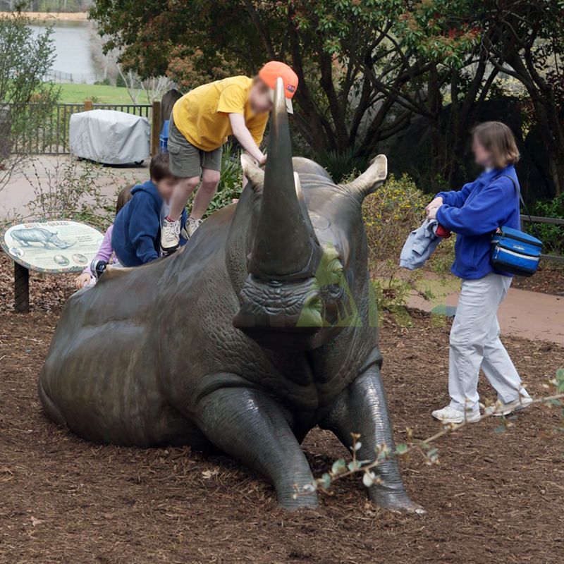 A large bronze statue of an African rhino