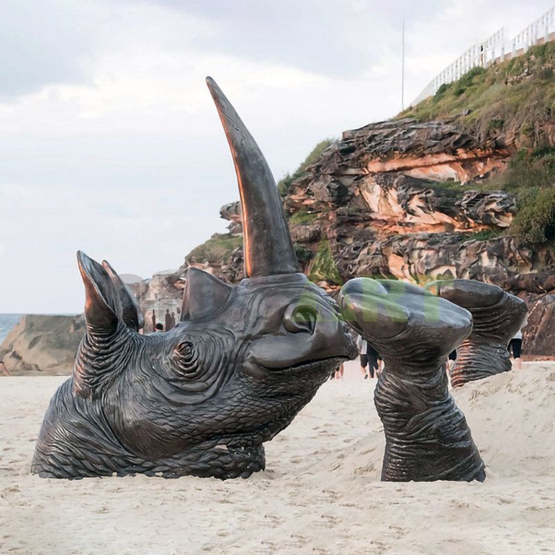 Bronze rhinoceros standing on a stone