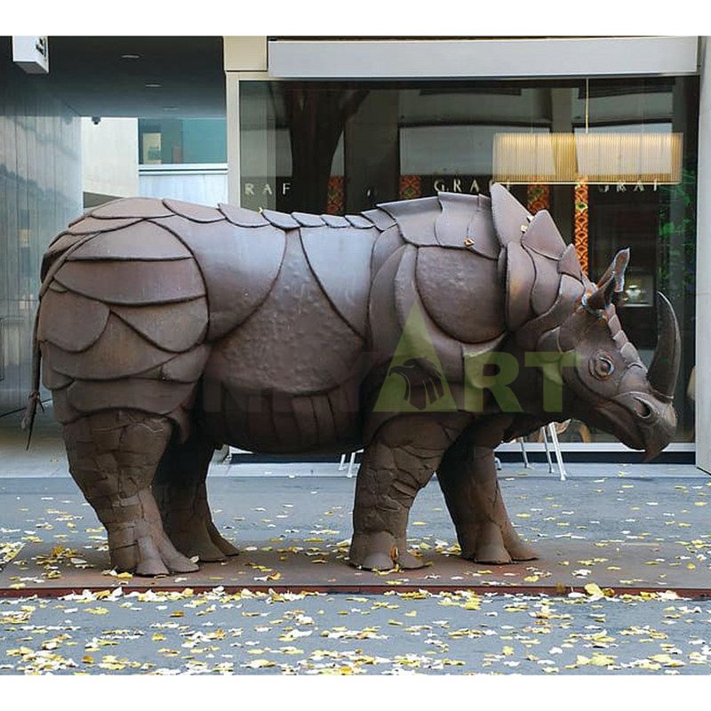 Large stainless steel rhino sculpture outdoor metal brushed geometric animal landscape