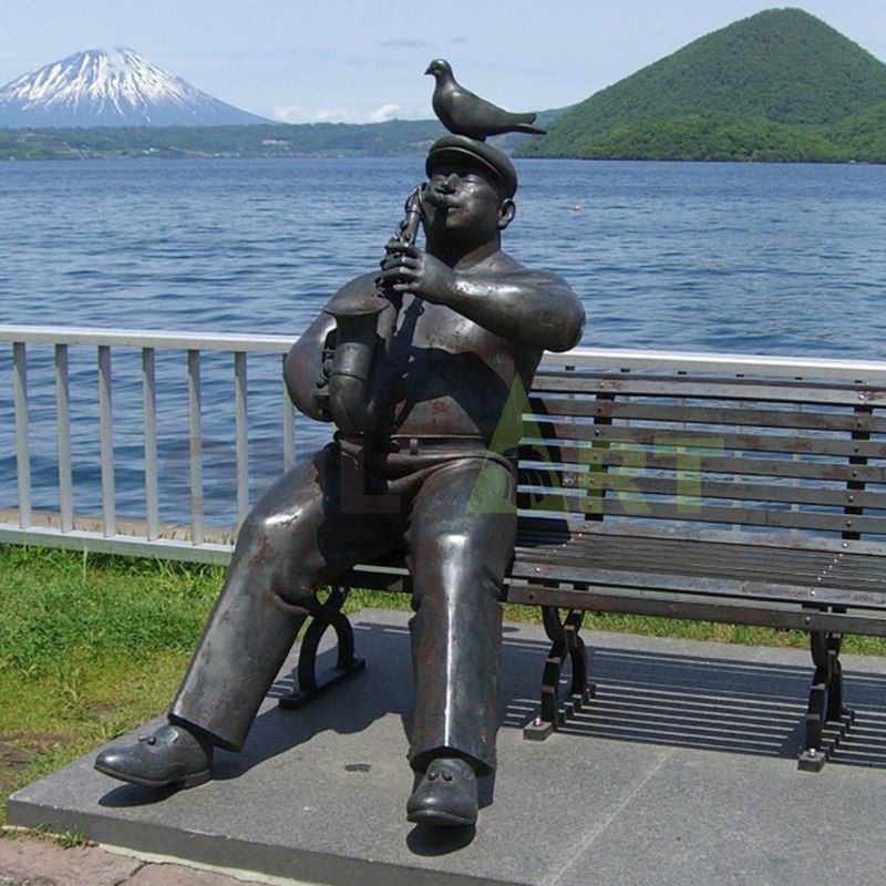 bronze sculpture of musician statue