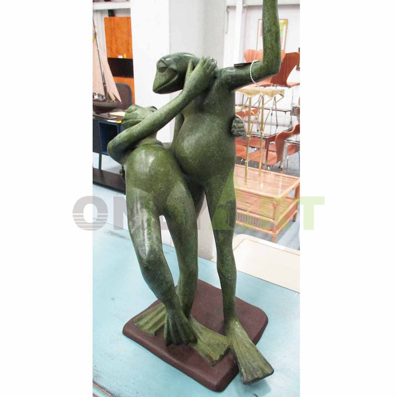 Frog couple dancing sculpture inside and outside