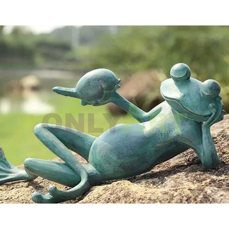 Realistic frog Prince Garden statue looking at the golden crown